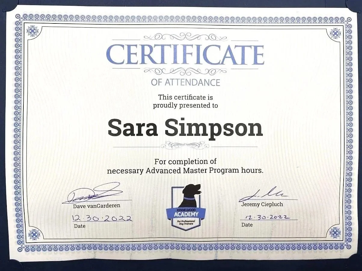 Certificate of attendance awarded to Sara Simpson for completing advanced master program hours, signed by Dave vanGarderen and Jeremy Ciepluch, dated December 30, 2022, from Kennelwood Academy for professional dog trainers.