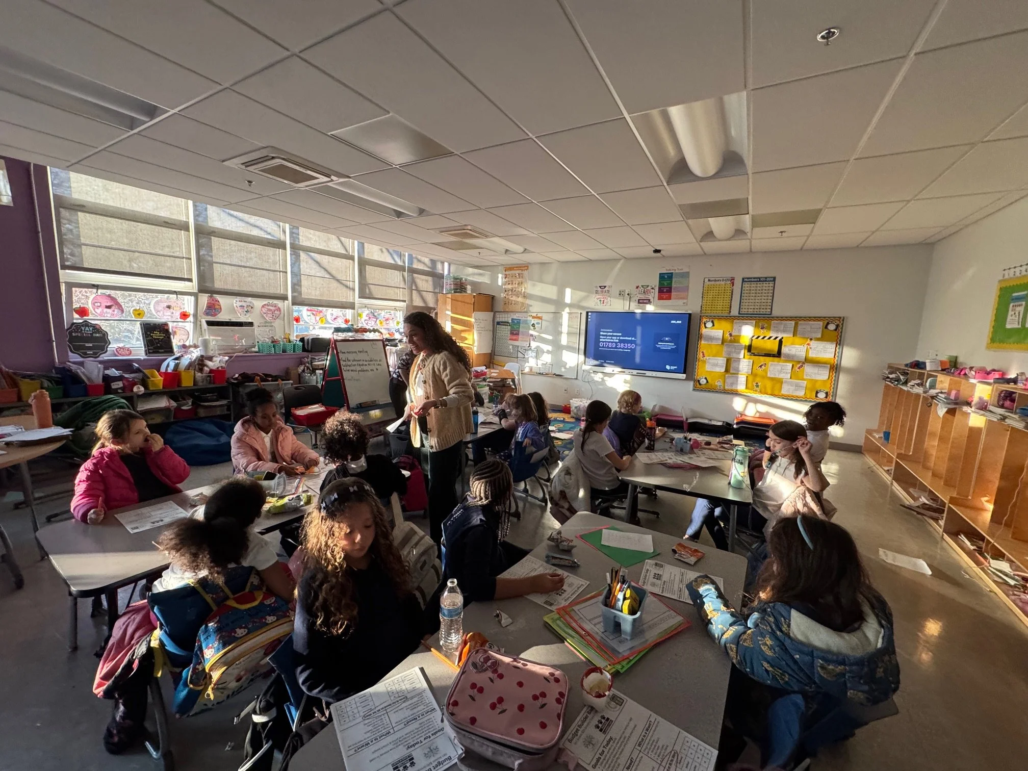 3rd grade brownie troop doing a grocery store budgeting activity