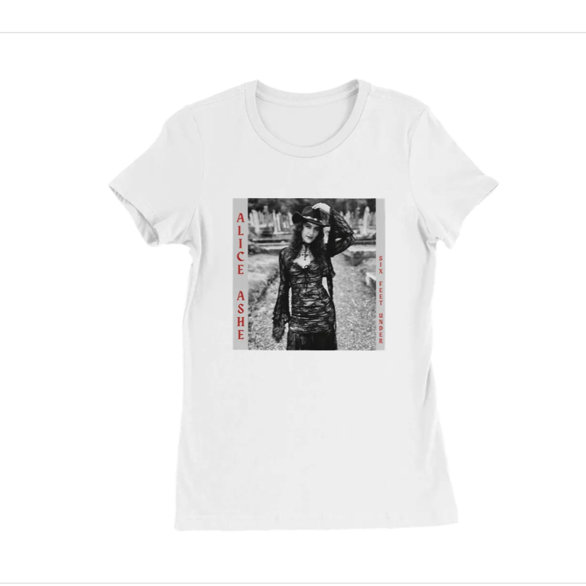 White T-shirt featuring a black and white photo of a woman in gothic attire, with red text on either side reading 'ALICE ASHE' and 'SIX FEET UNDER'.
