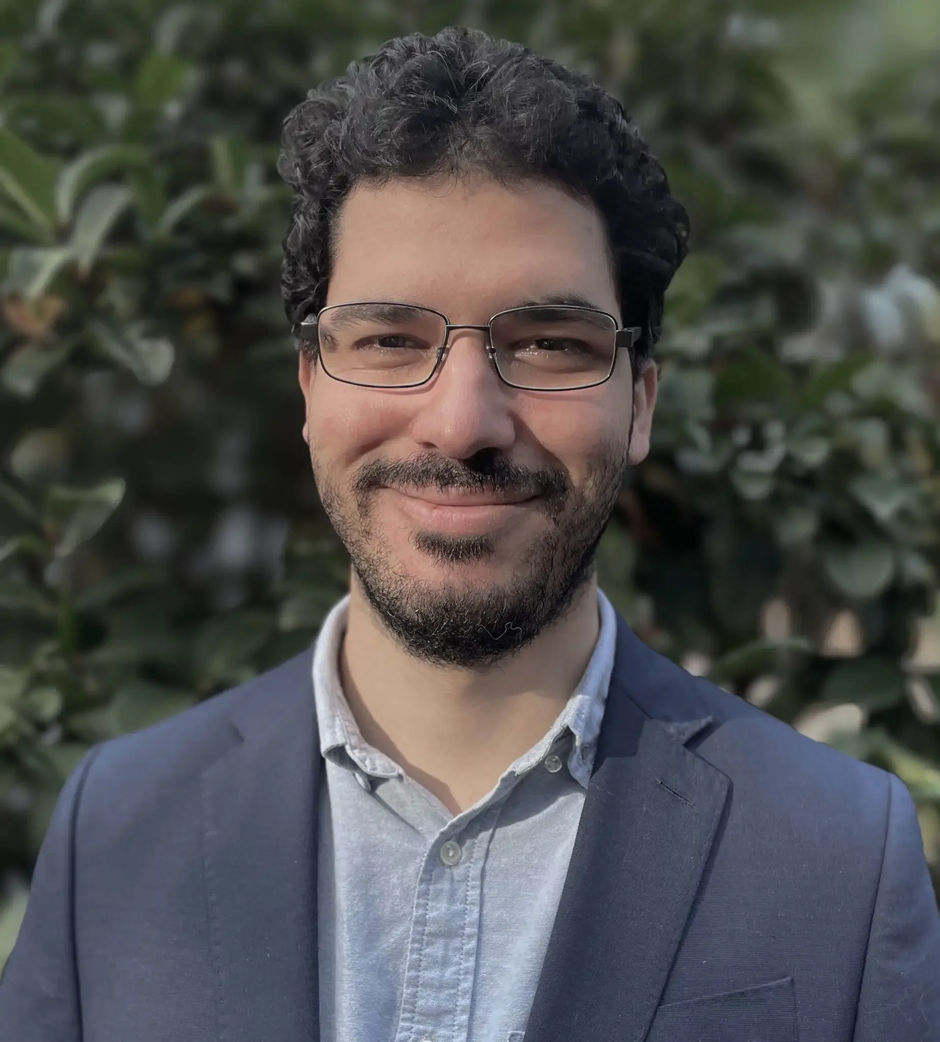 Joseph Brooks, Registered Mental Health Counselor Intern in Florida, professional therapist headshot outdoors.