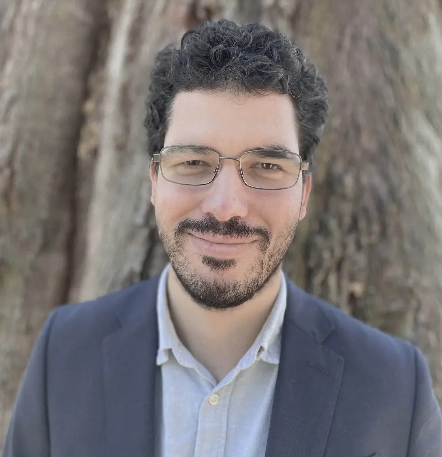 Joseph Brooks, RMHCI therapist in Florida, specializing in ADHD and porn addiction professional headshot outdoors smiling.