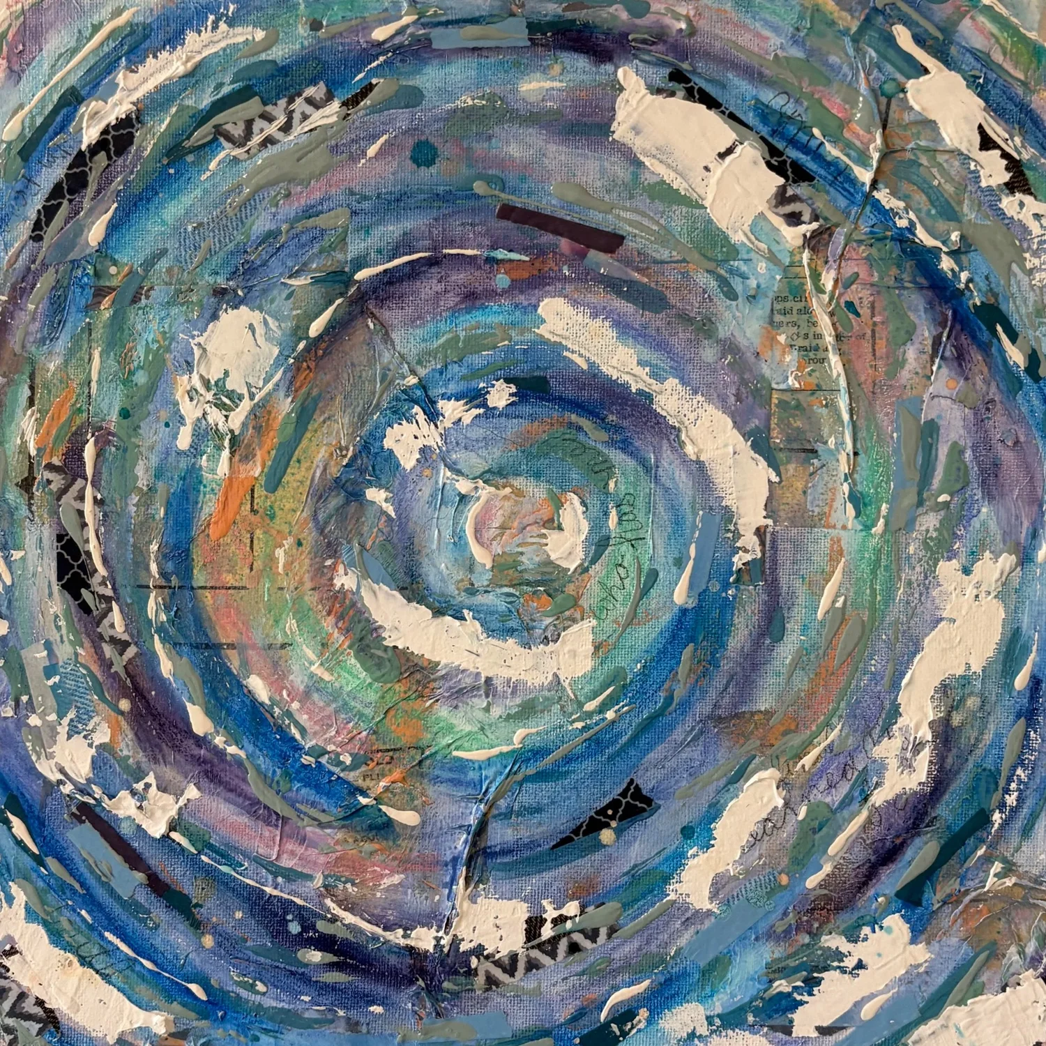 Layered abstract mixed-media artwork in blue, teal, cream, and gold
