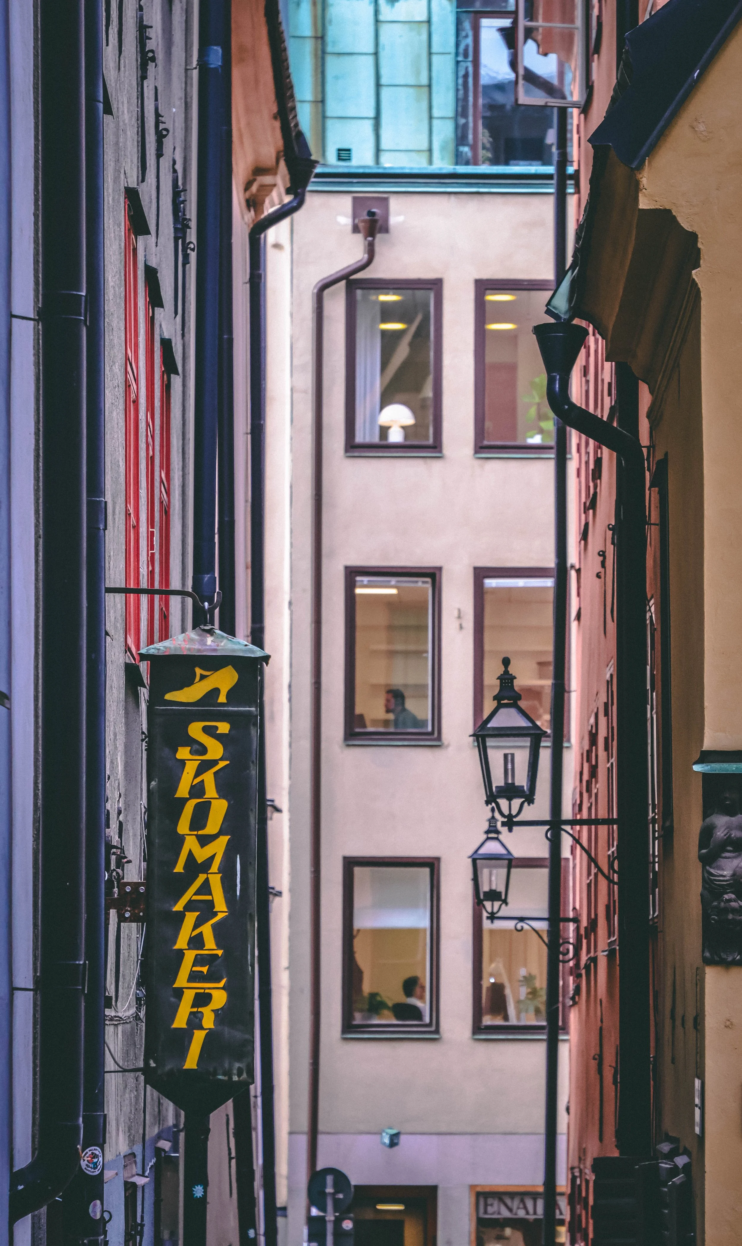 "The Cobbler's Autumn"
In the heart of old Stockholm, tucked between amber-bricked buildings and beneath a canopy of golden leaves, lived a cobbler named Emil. His shop, Skomakeri Solsteg, was a narrow nook on a quiet alleyway, where the scent of l