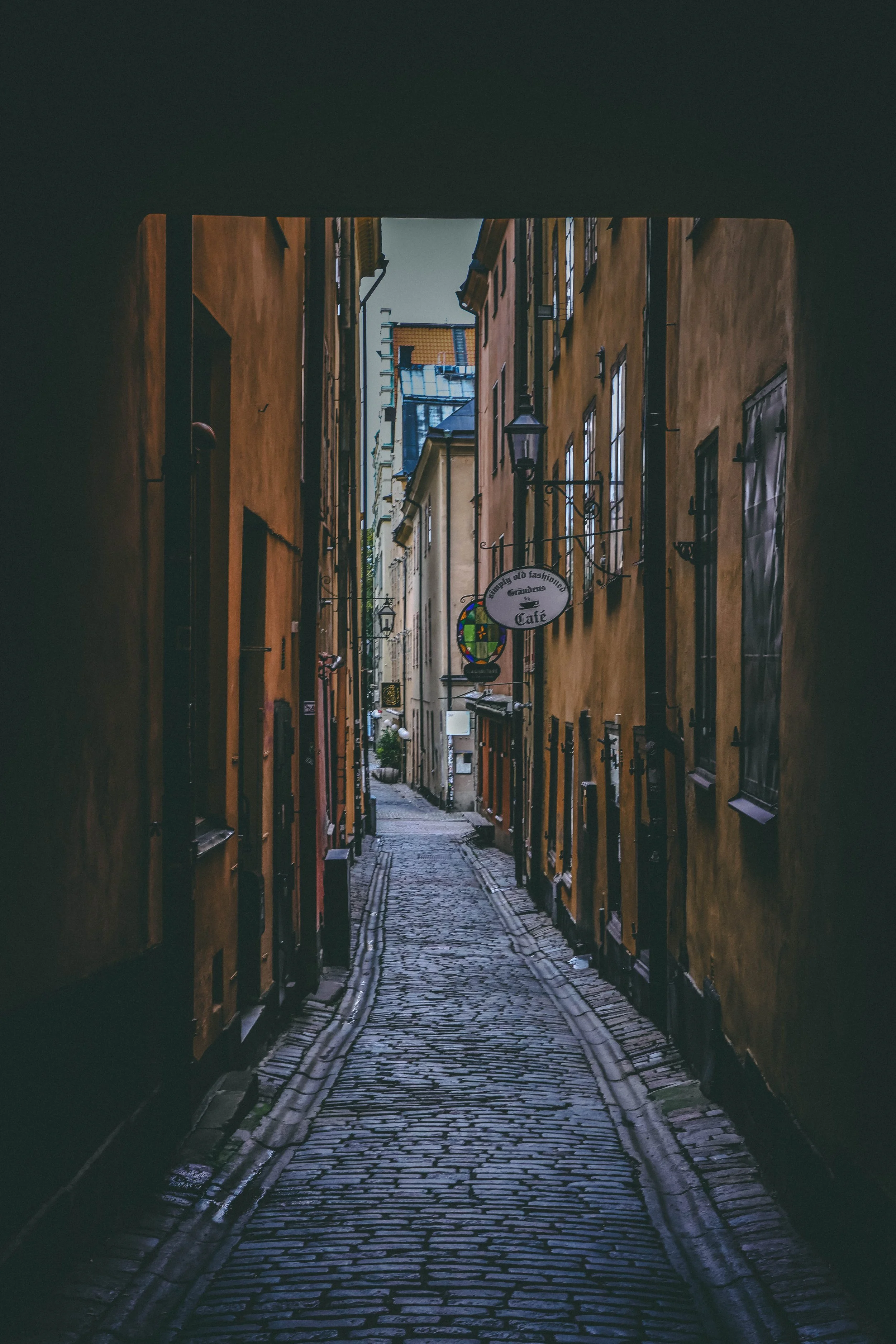"The Lantern Keeper's Secret"
On a cold, brisk autumn evening in the winding alleys of Gamla Stan, the cobblestones gleamed with recent rain and the scent of roasted chestnuts drifted from a nearby cart.
The streetlamps flickered to life, casting