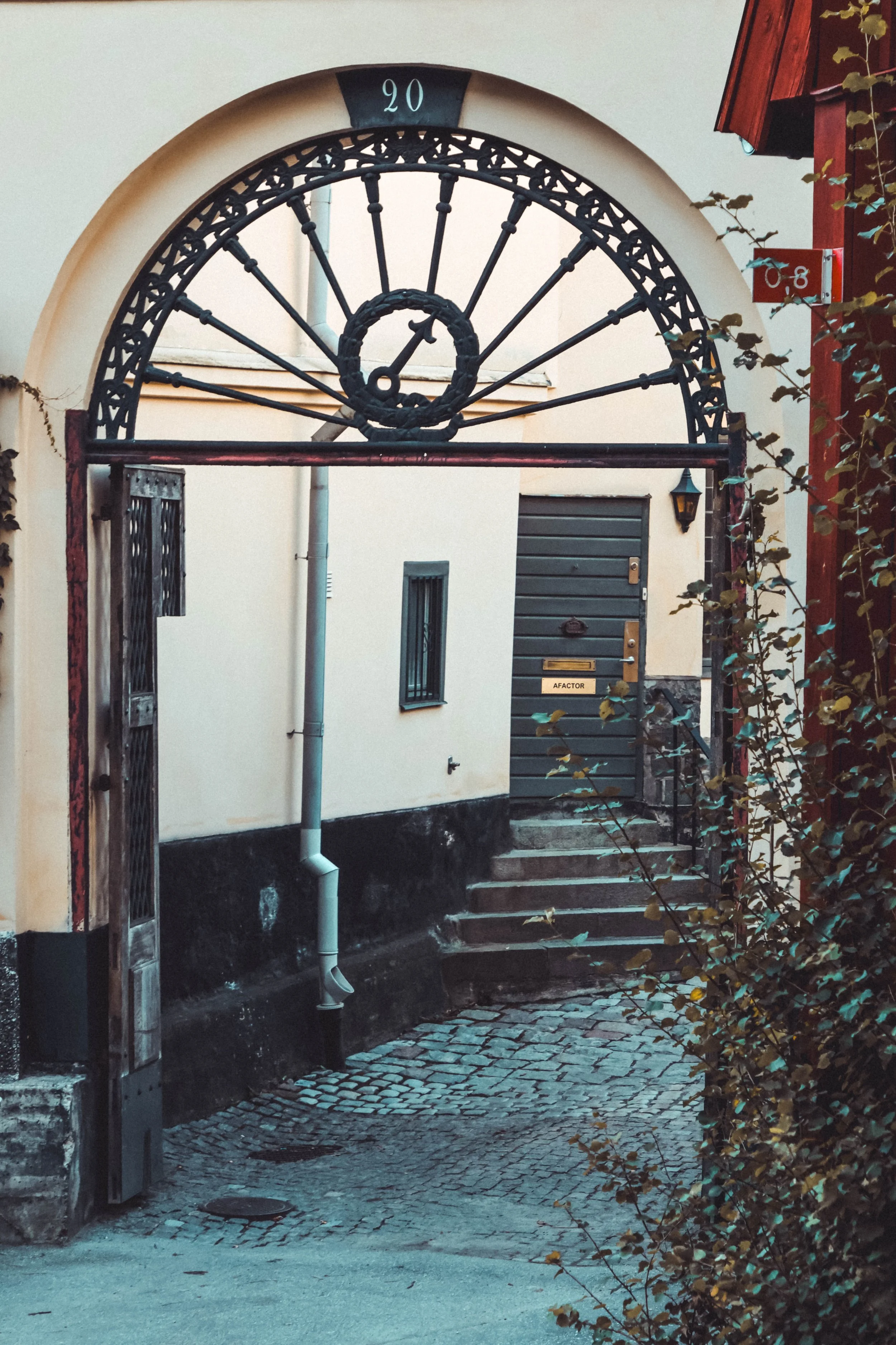Every doorway holds a whisper from the past.
Tucked behind wrought iron and cobblestone, this quiet alleyway invites you into a world where architecture speaks and history lingers. The faded walls, the sunburst arch, and the name on the doorâeach el
