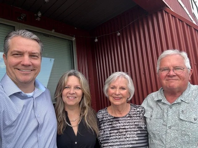 With her husband and parents