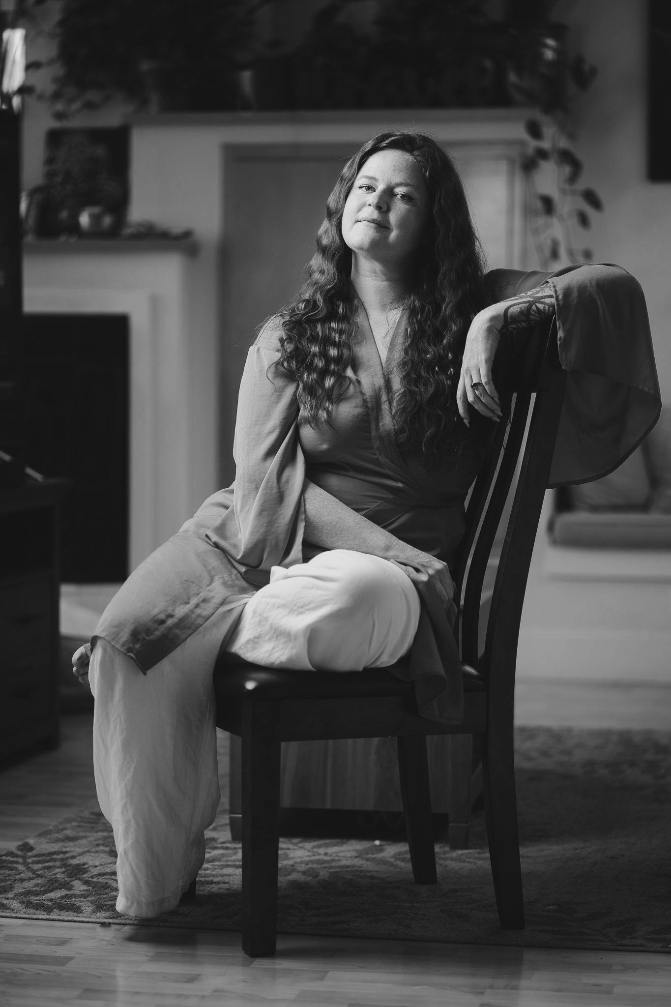 Annelise sitting on chair.