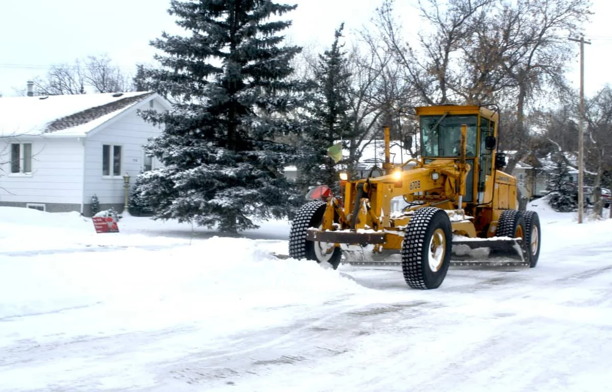 Plowing street after blizzard