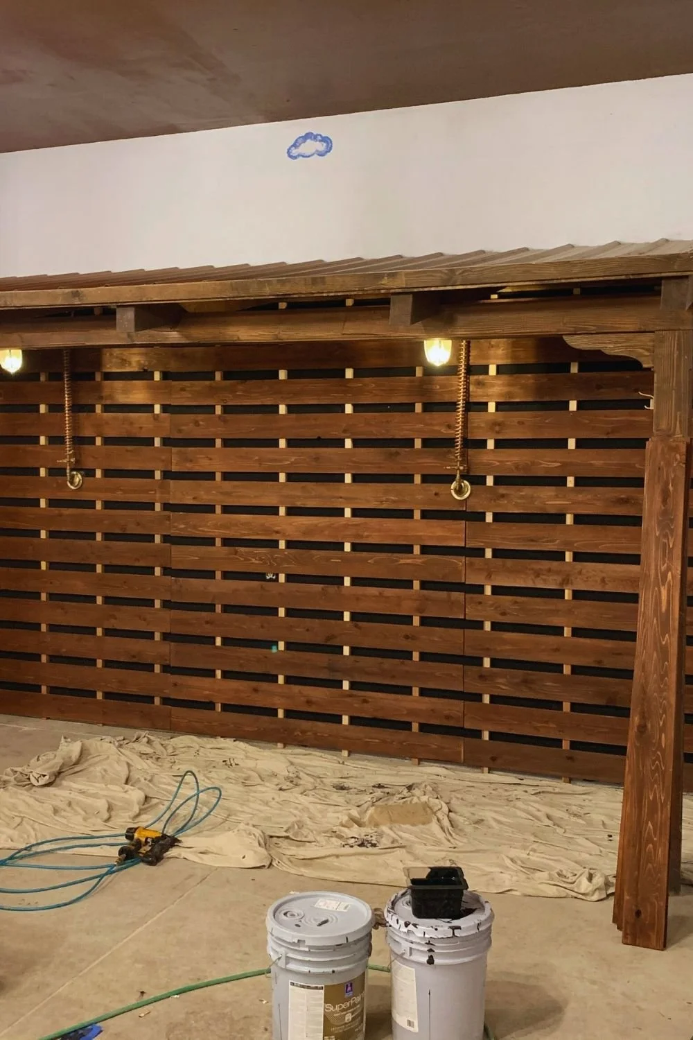 Wood accent wall installation in progress by JECAM