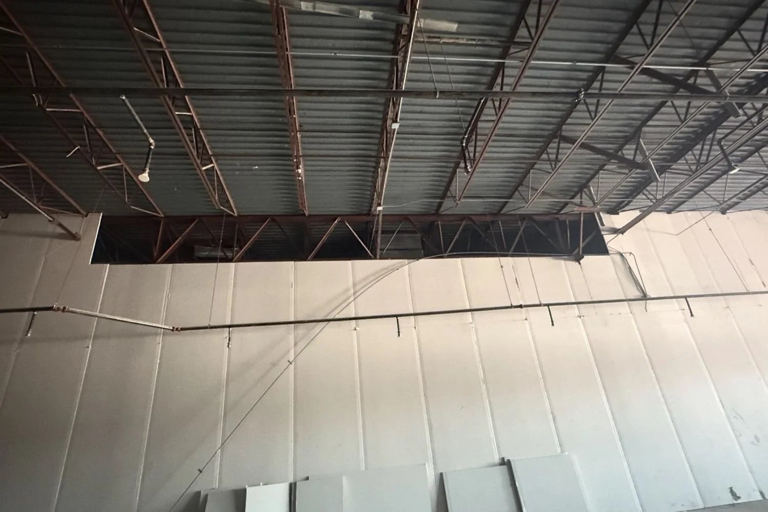 Commercial ceiling framing and metal roof structure installation by JECAM