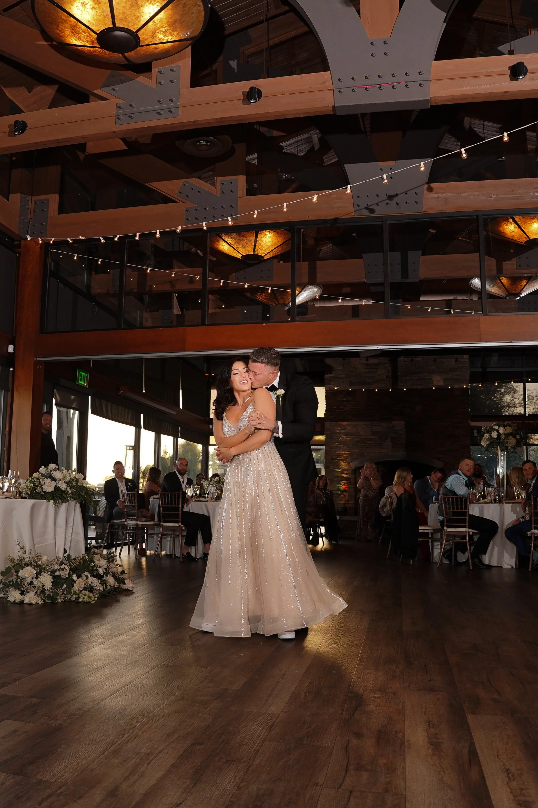 Intimate first dance at the Crossings wedding reception in Carlsbad, featuring a bride in a sequined A-line dress.