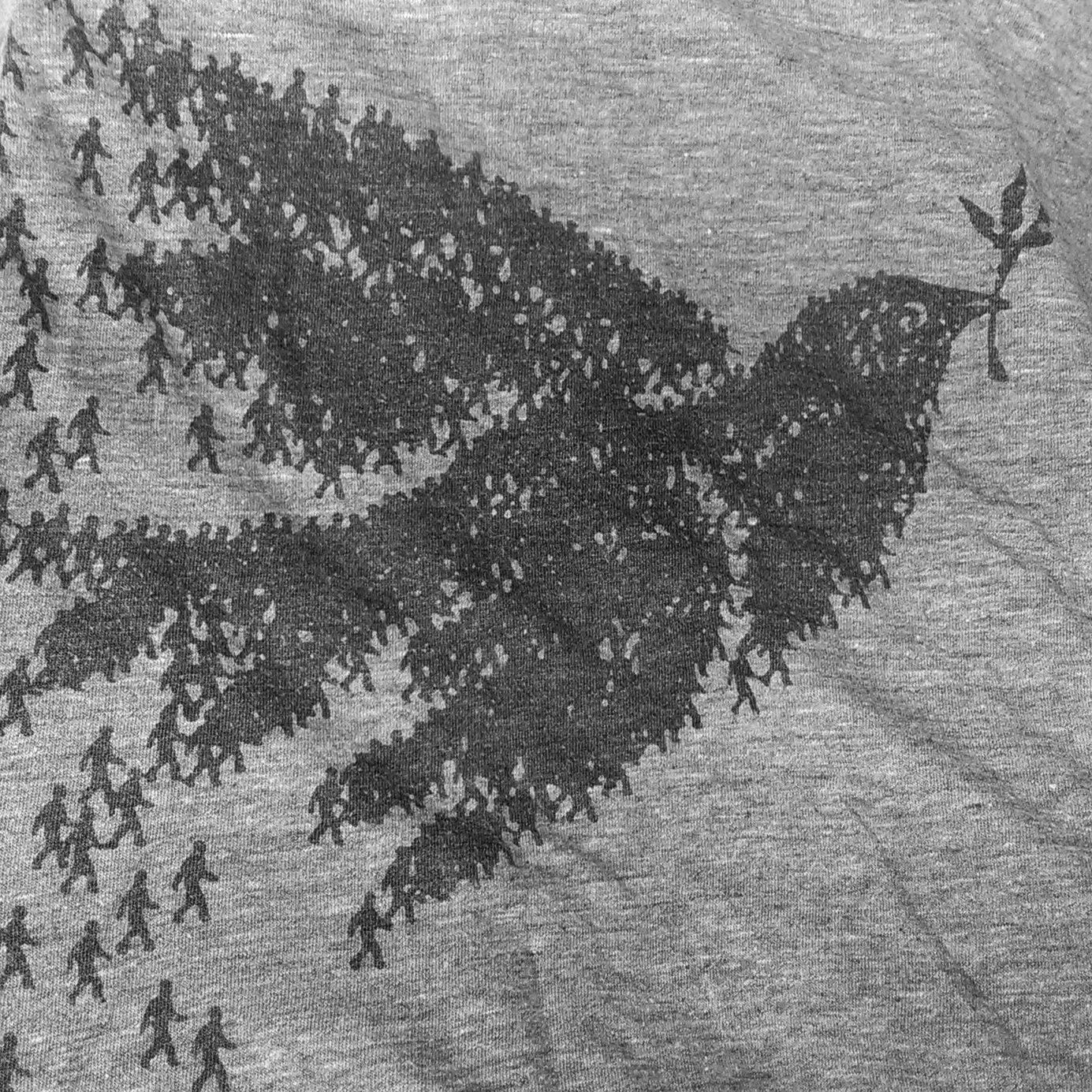 People coming together to form the shape of a dove (the symbol of peace)