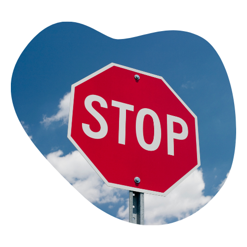 A red stop sign against a blue sky, symbolizing the ADHD strategy of pausing before reacting.