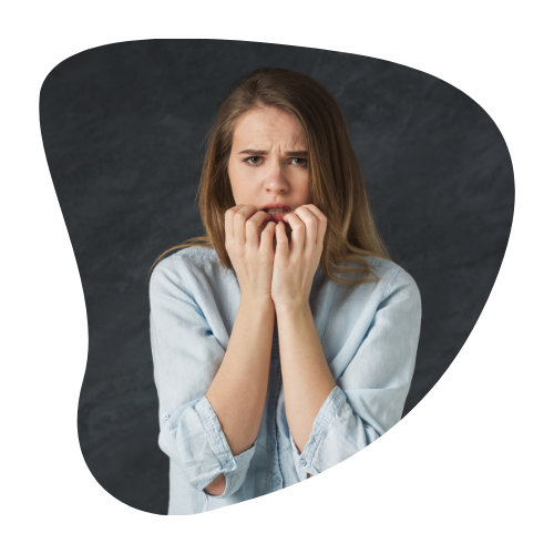A person biting their nails with a worried expression, illustrating the anxiety and fear that can overpower hope during difficult times.