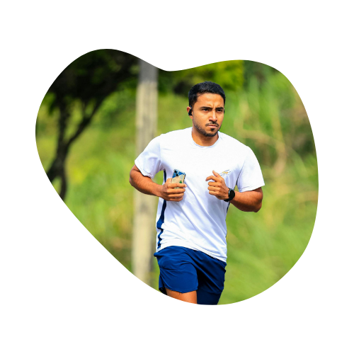 Man jogging outdoors in athletic wear, holding a phone, representing taking proactive steps to build mental and physical resilience in ADHD management.
