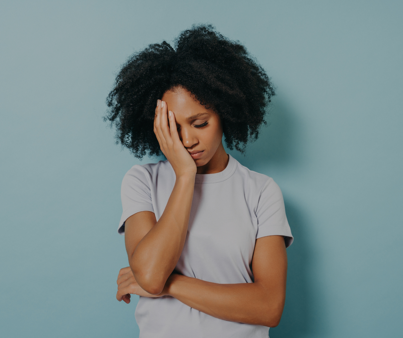 Person experiencing emotional stress and fatigue seeking support through integrative mental health care