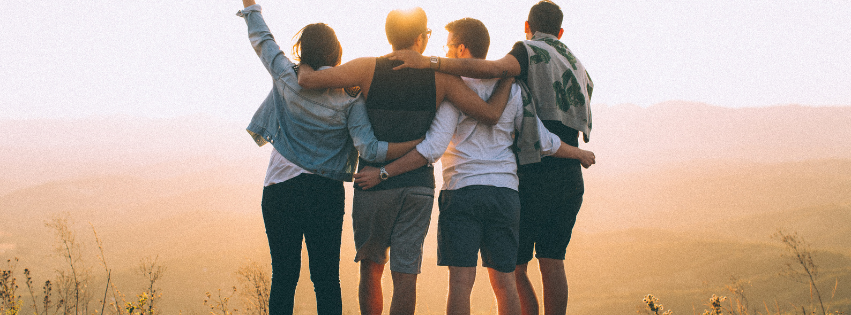 Group of friends walking together outdoors at sunset, representing renewed energy, vitality, and whole-person wellness at True Health Integrative Clinic in Winnipeg.