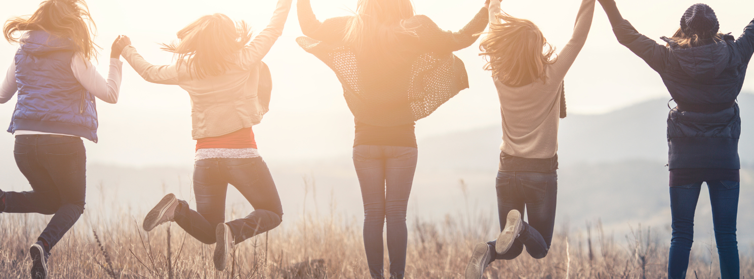 Group of women celebrating health, connection, and wellness through a supportive integrative care community