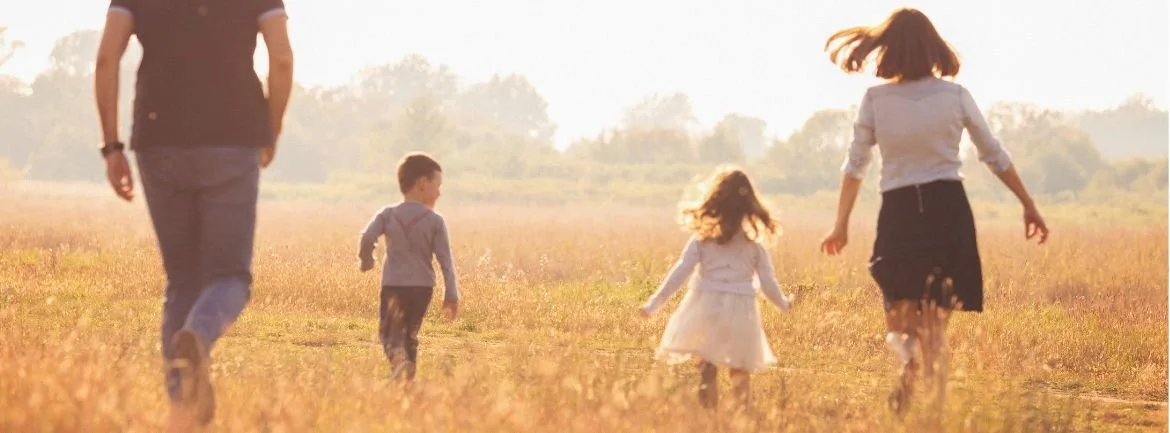 Family walking together outdoors, representing healthy childhood development and family-centred pediatric care at True Health Integrative Clinic in Winnipeg.