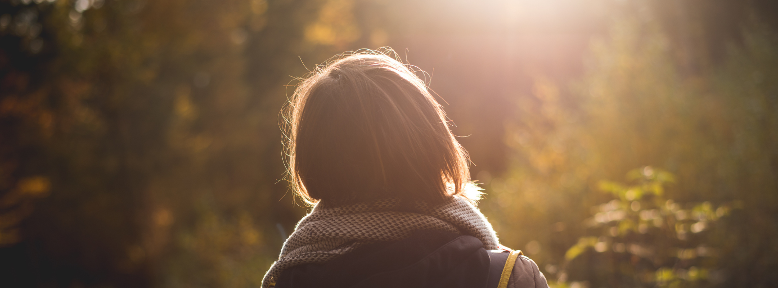 Person spending time in nature to support mental health, emotional balance, stress resilience, and overall wellness