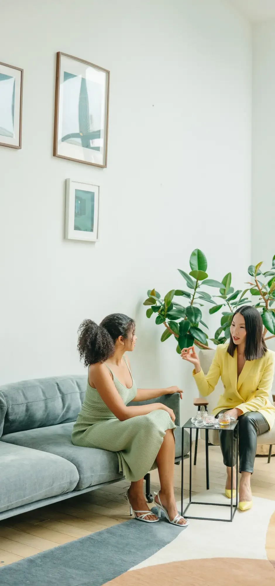 Occupational therapist meeting with a client in a welcoming clinic setting to develop personalized strategies that improve daily function, independence, and overall quality of life.