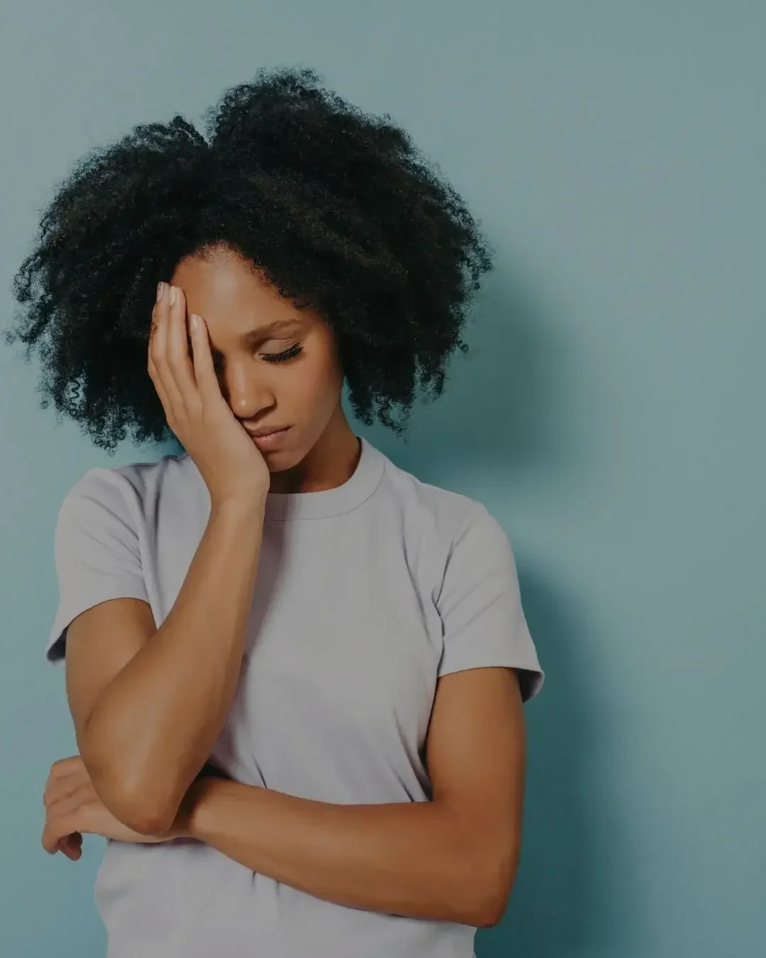 Person experiencing emotional stress and fatigue seeking support through integrative mental health care