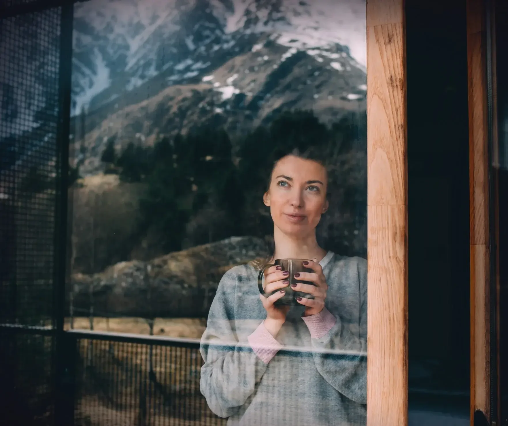 Woman taking a quiet moment for rest, reflection, and hormone wellness support through integrative women’s health care