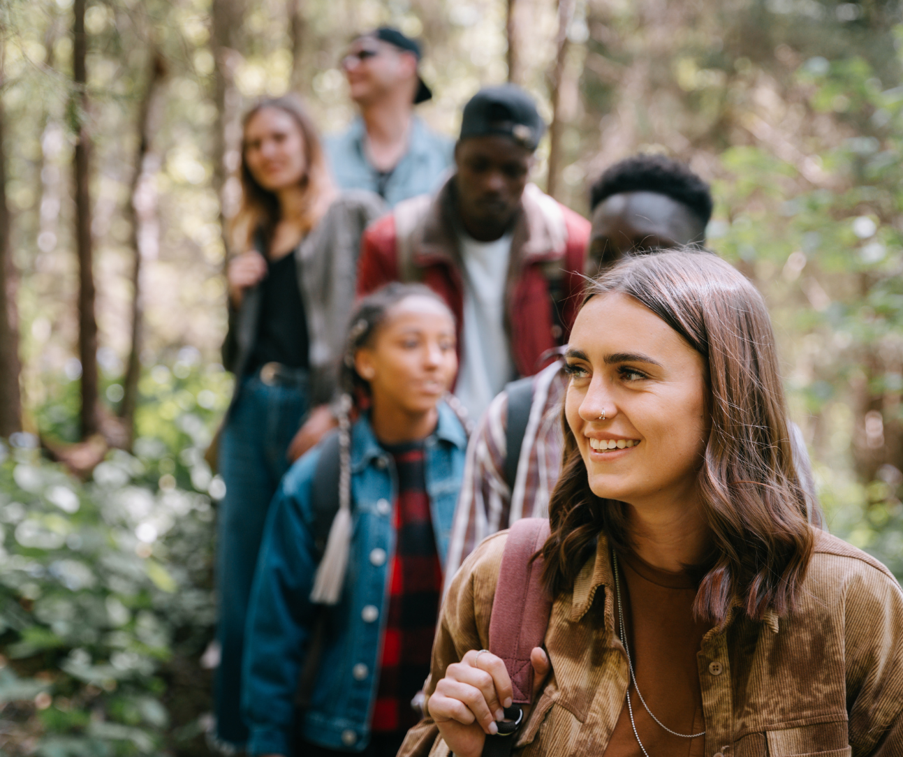 “Group of young adults walking outdoors to support hormone health, energy, stress resilience, and overall wellness