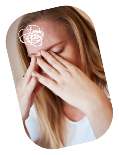 A woman appears distressed, covering her face with her hand and rubbing her forehead, with a scribble icon indicating frustration or headache.