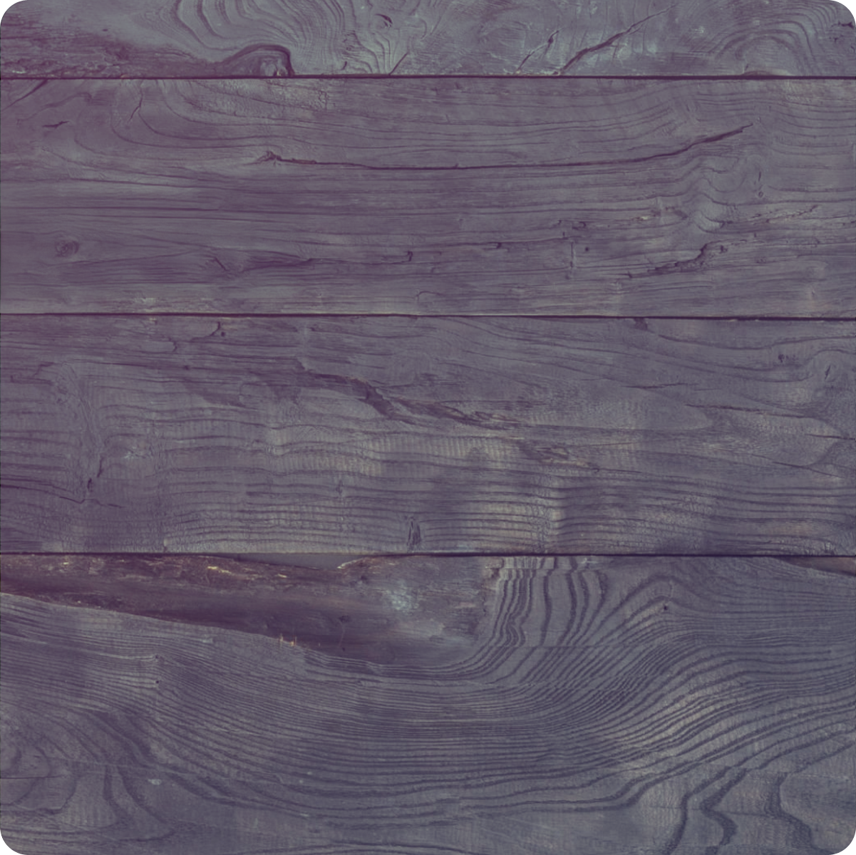 Close-up of weathered wooden planks with visible grain patterns.