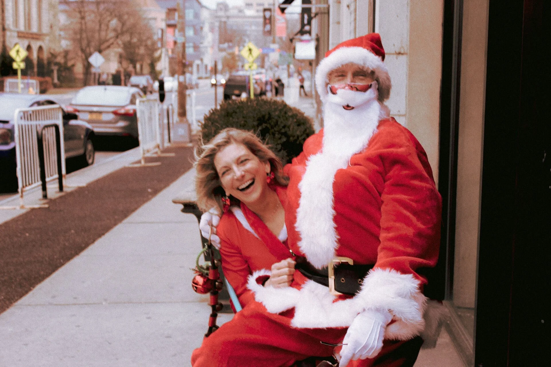 Organizers of Kringle Krawl sit outside on East Ave