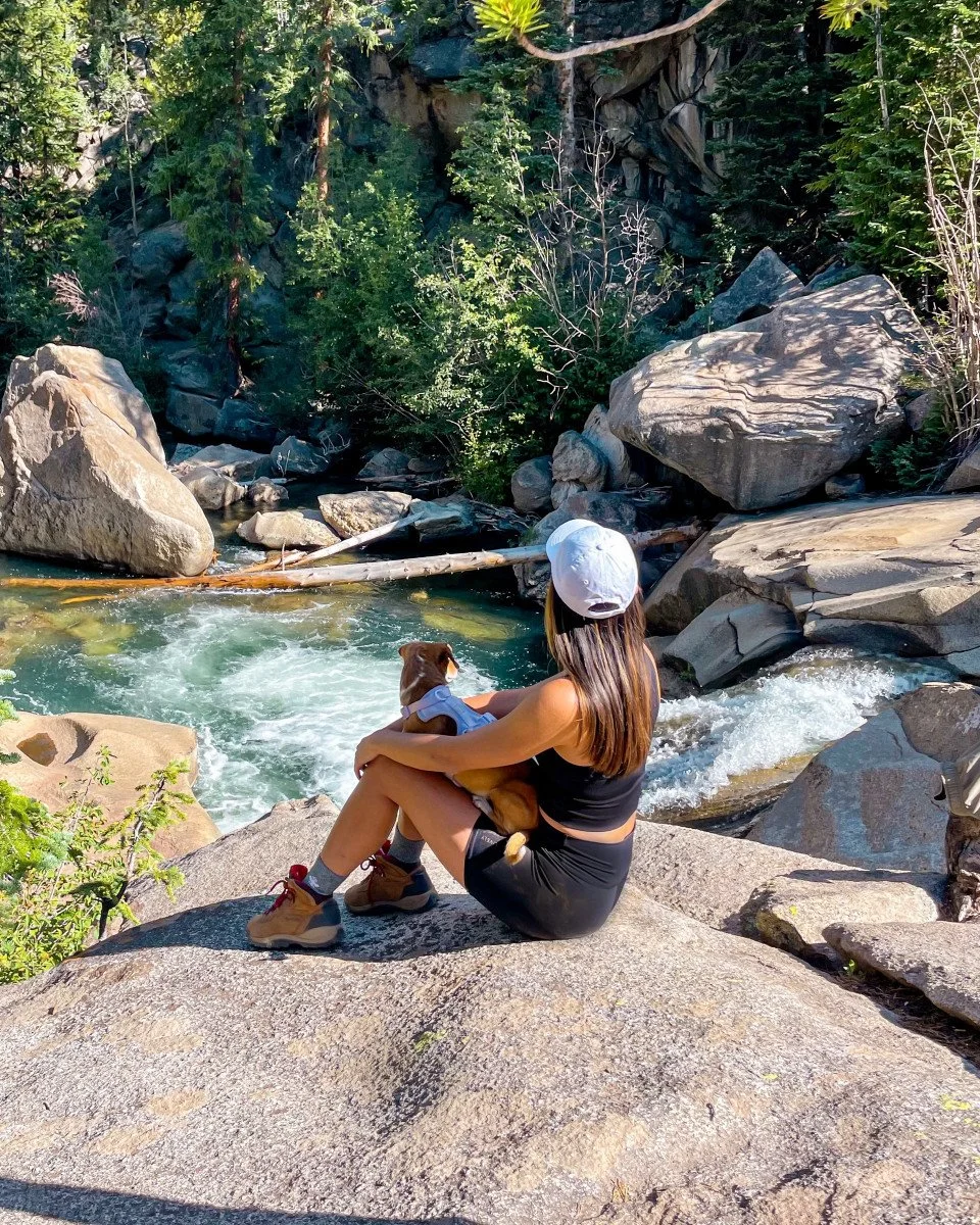 woman in nature with her pup