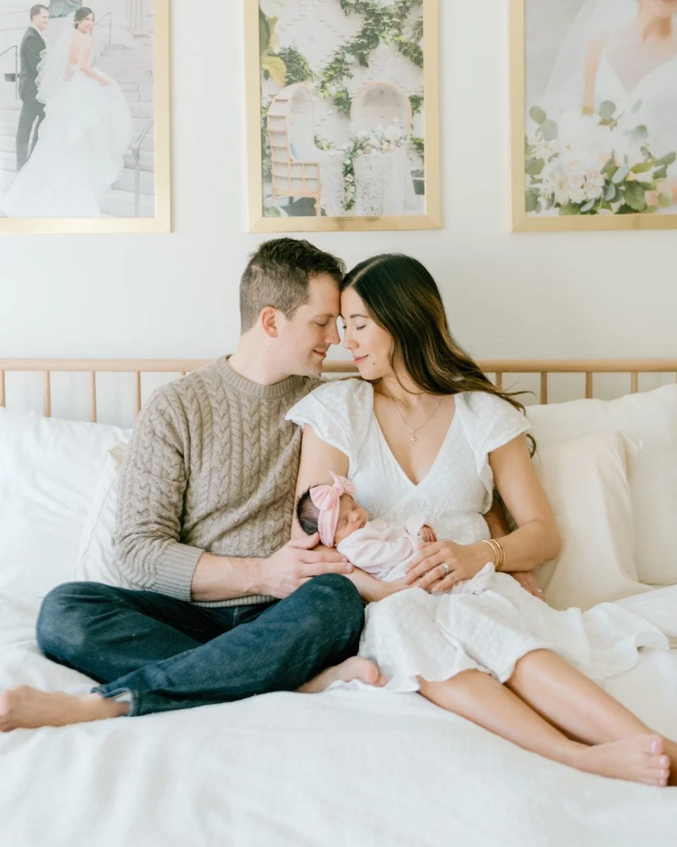 new parents holding baby