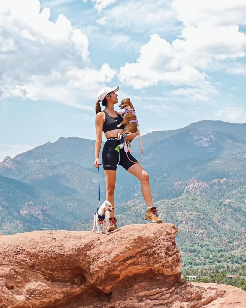 woman hiking with her pups