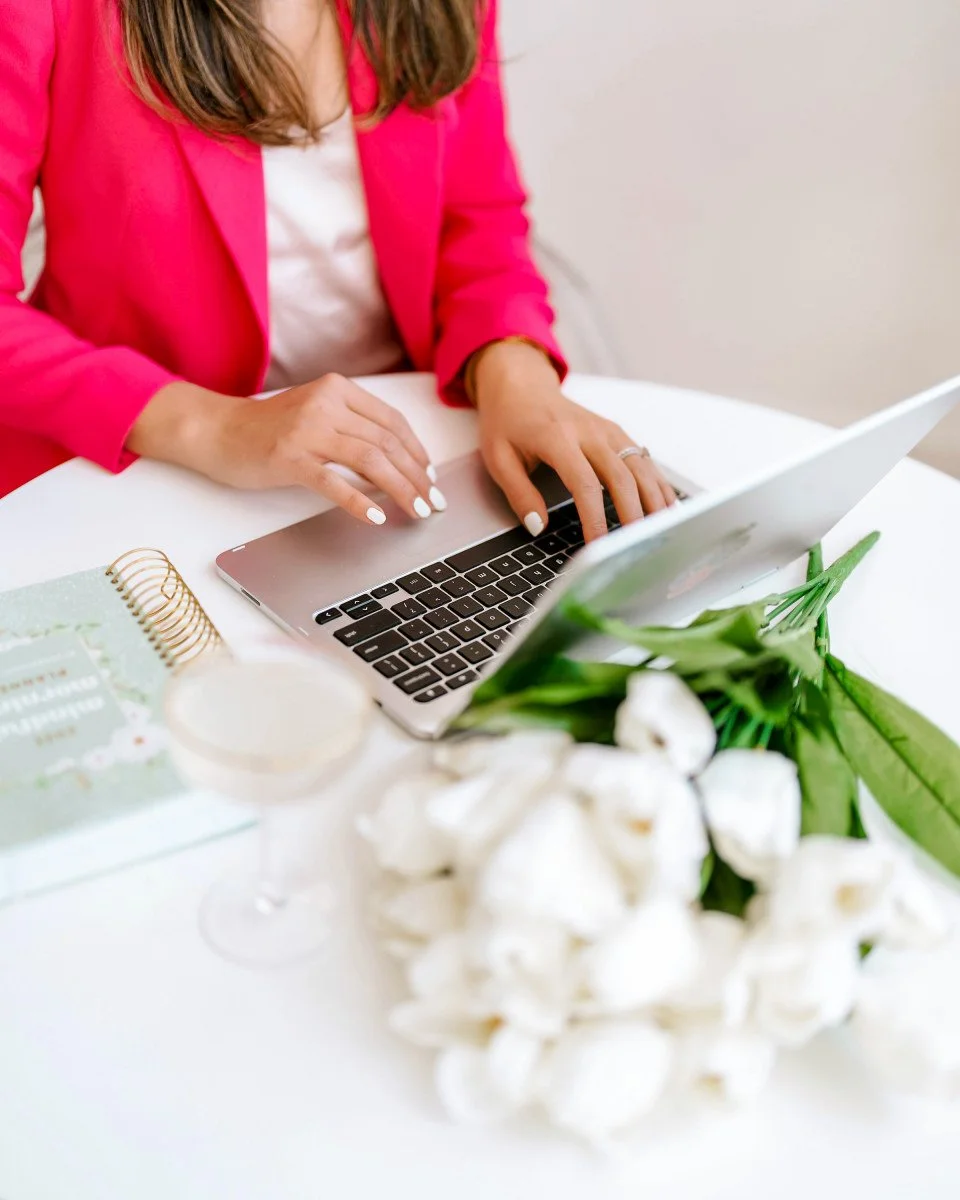 woman typing on her laptop