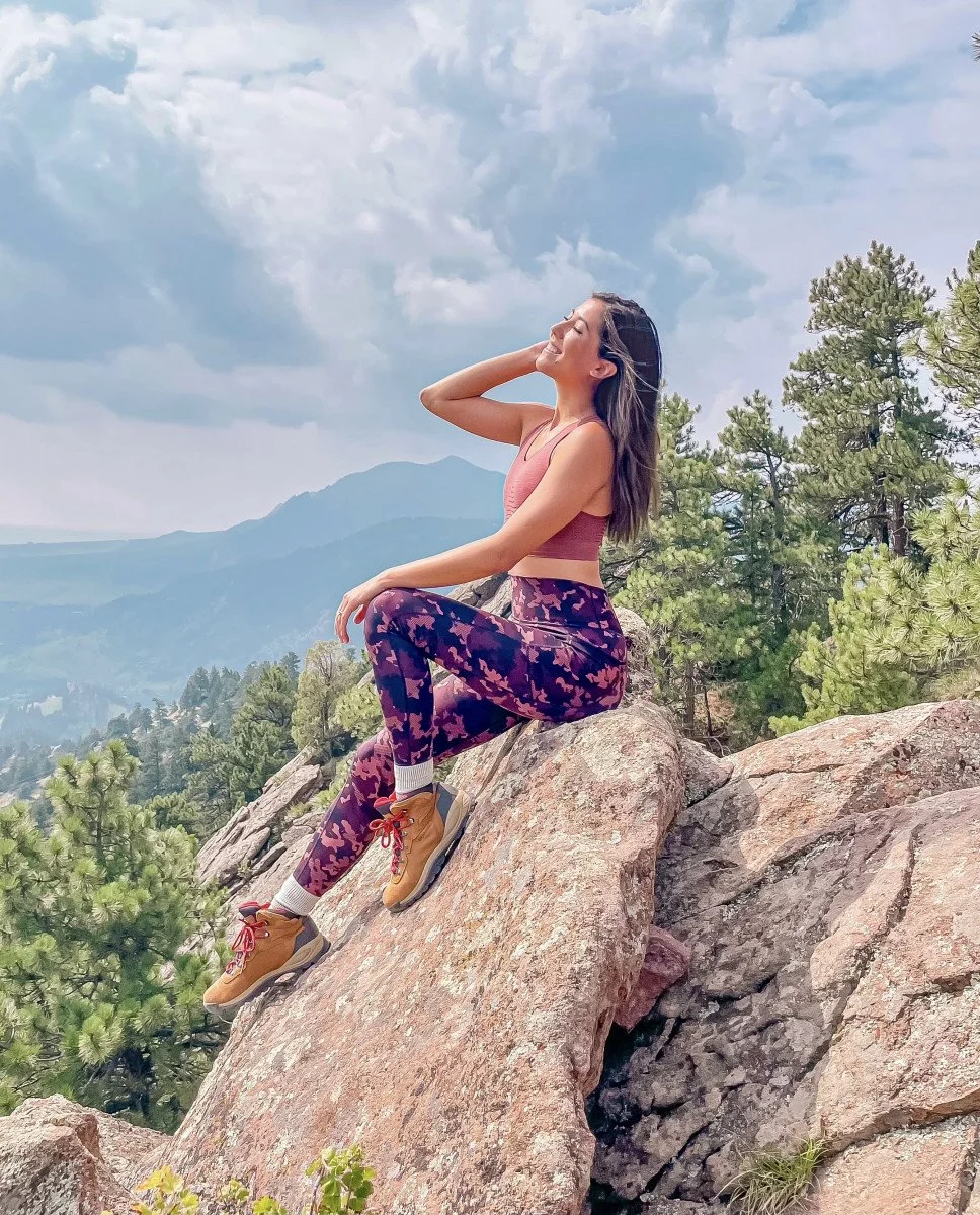 woman posing on rocks hike