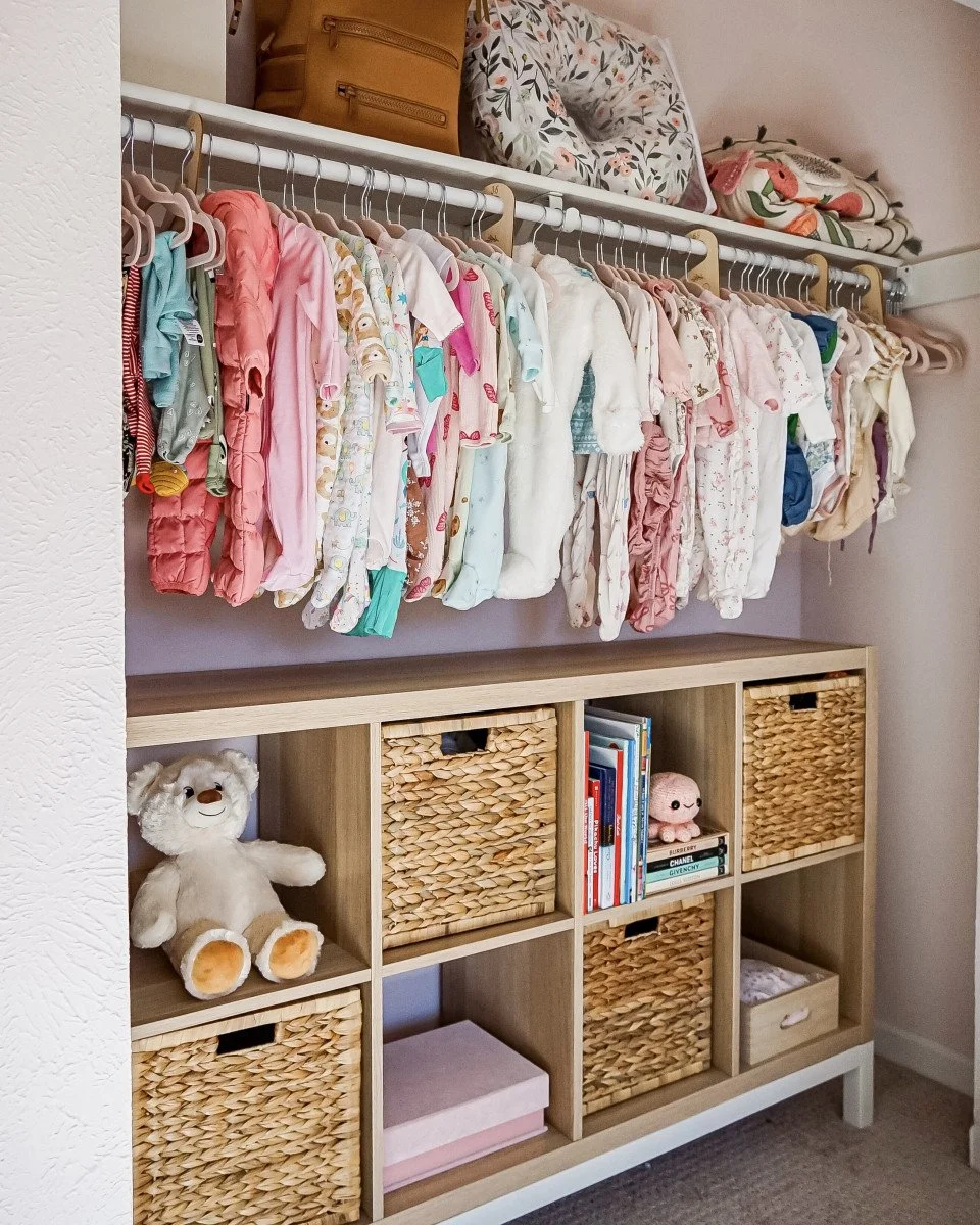baby girl clothes in closet
