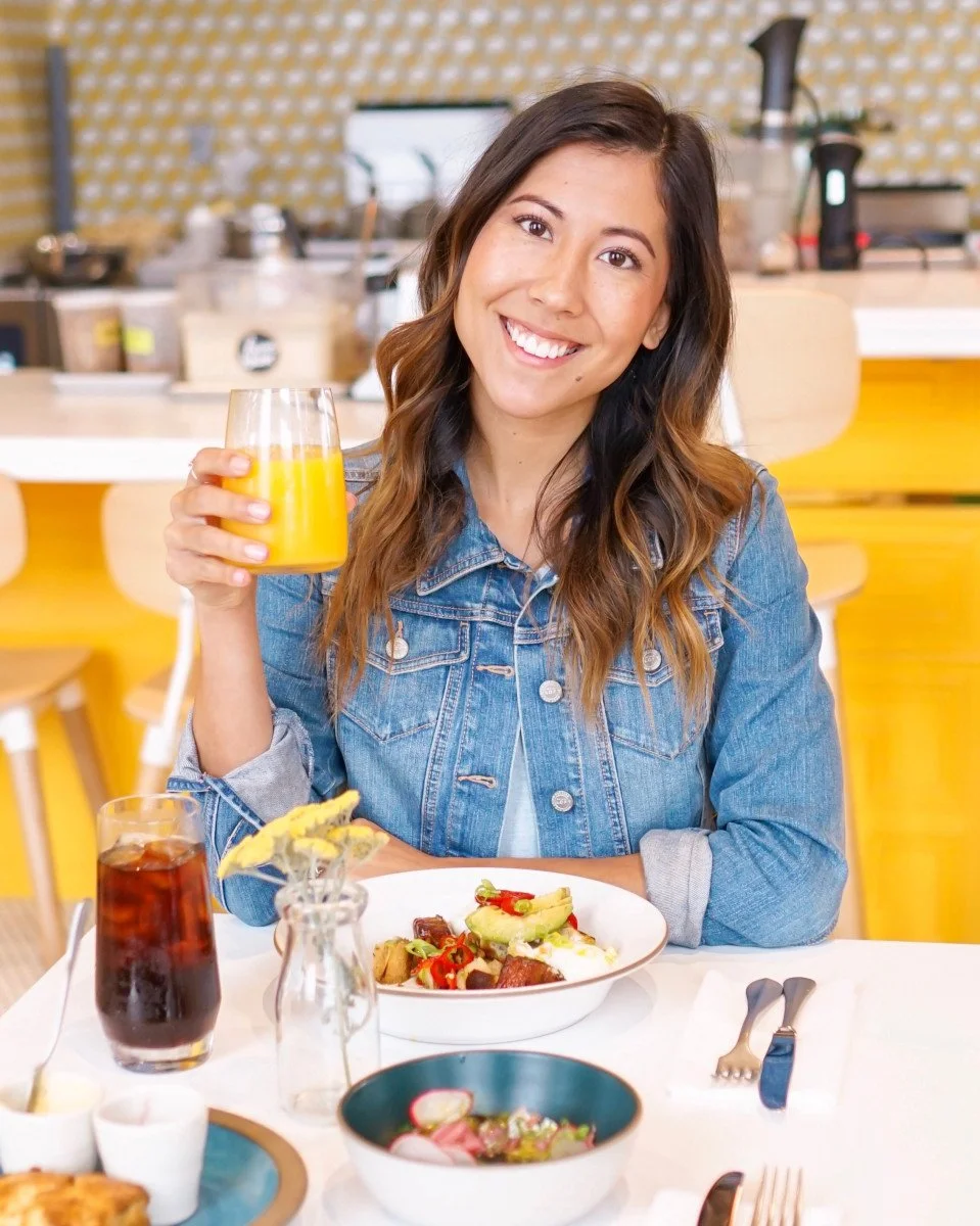 woman drinking orange juice