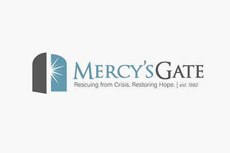 Mercy's Gate logo with an open door and a star burst, tagline 'Rescuing from Crisis. Restoring Hope.' and established year 1982