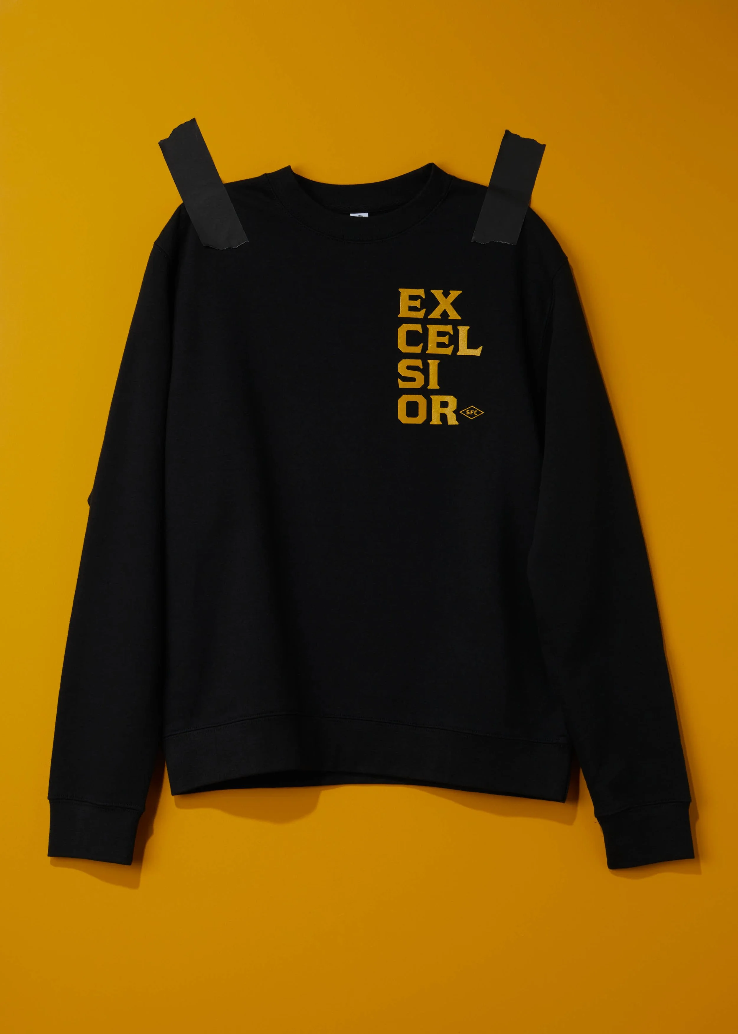 EX-CEL-SI-OR TEXT BREAK CREWNECK