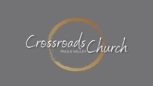 Crossroads Church logo with text and a circular design on a gray background.