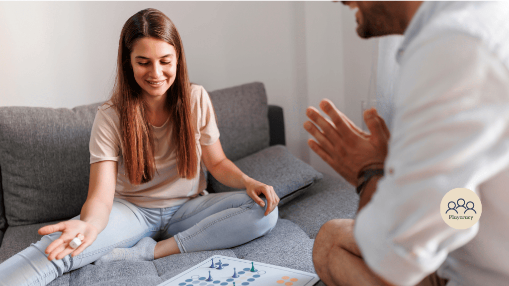 A man and a woman play a 1v1 game on their couch