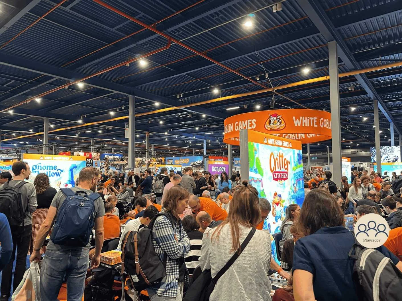 Overview of Spiel Essen, showing multiple stands and players