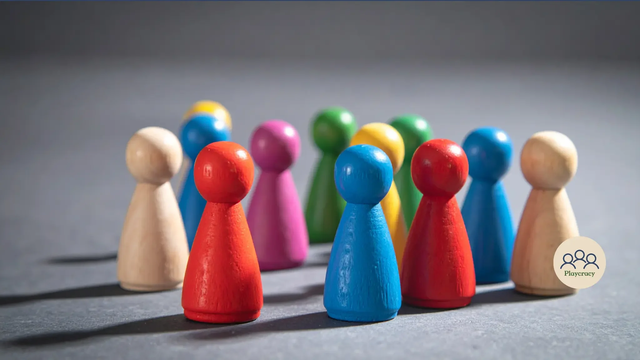 Meeples on table, of different colors