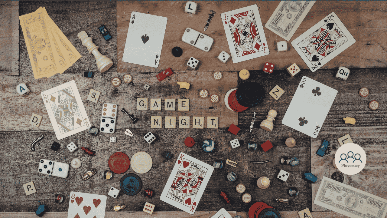Meeples, cards and coins from different games placed on a table