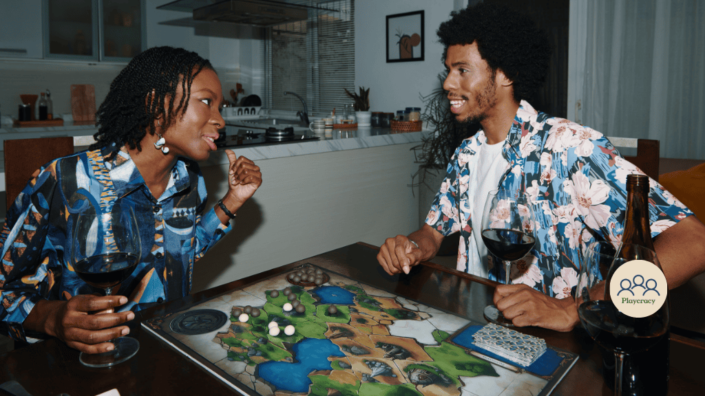 Two players enjoy a board game with a glass of wine