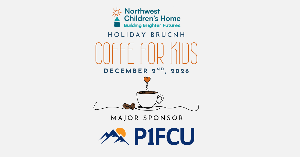 A black travel mug with a handle, displaying the logo of Northwest Children's Home, Inc., placed on a wooden surface with a blue, bokeh background.