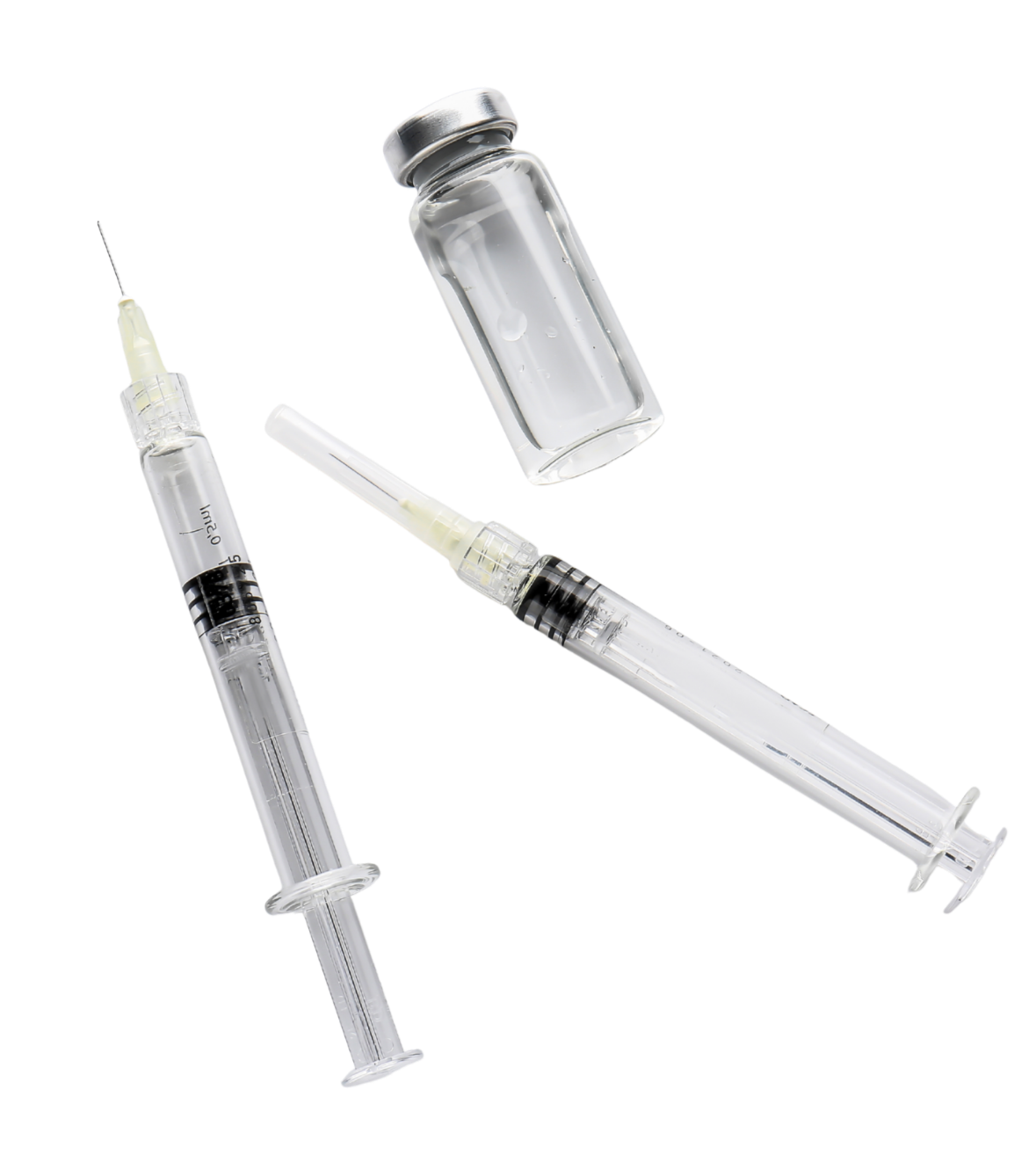 Two syringes and a glass vial, likely containing a vaccine or medication, on a white background.