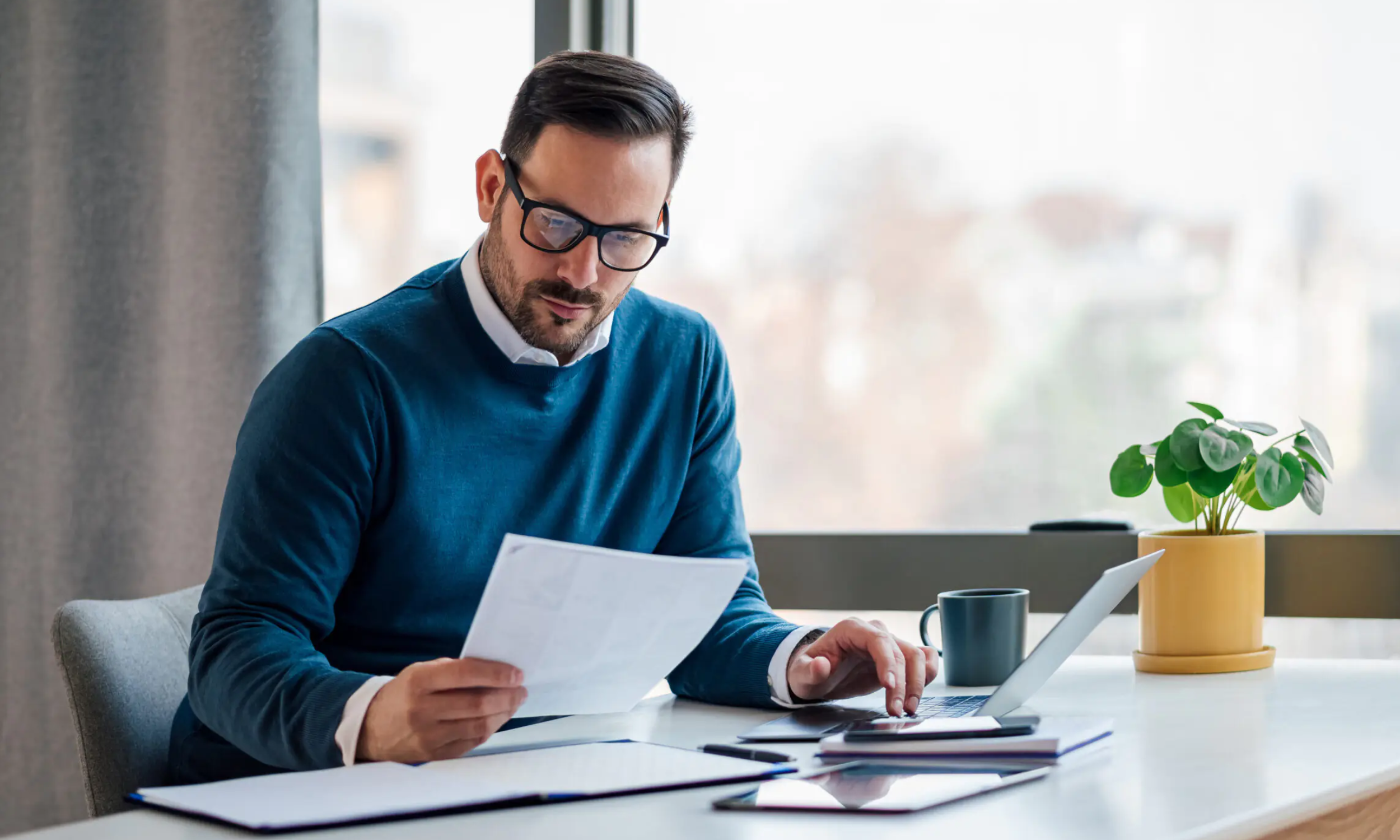 Business owner reviewing employee healthcare benefits options in Fort Mill, SC