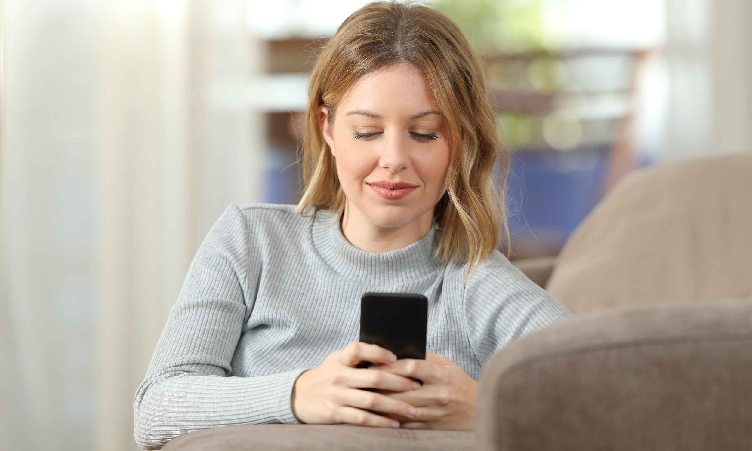 Patient sending a text message to their direct primary care doctor in Fort Mill, SC